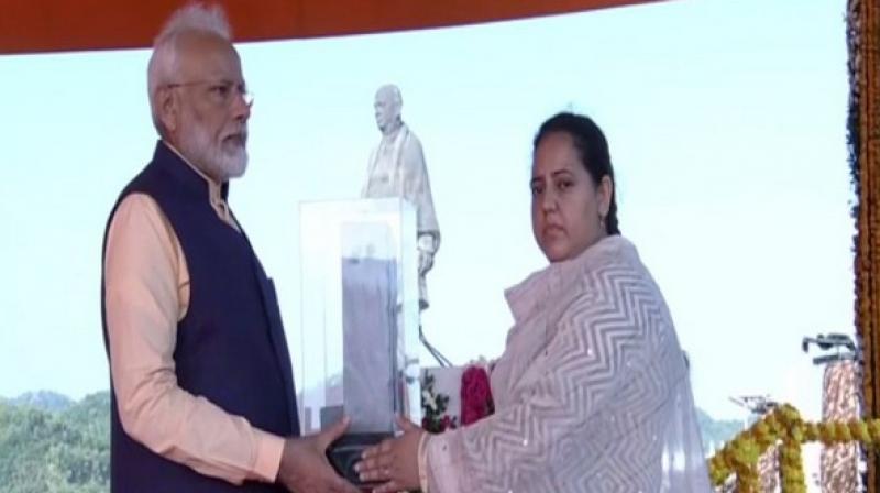 PM Modi receives memorial from wife of CRPF personnel killed in Pulwama attack