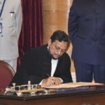 Justice SA Bobde signs on a register after taking oath as the 47th Chief Justice of India (CJI) at Rashtrapati Bhavan, in New Delhi, Monday.