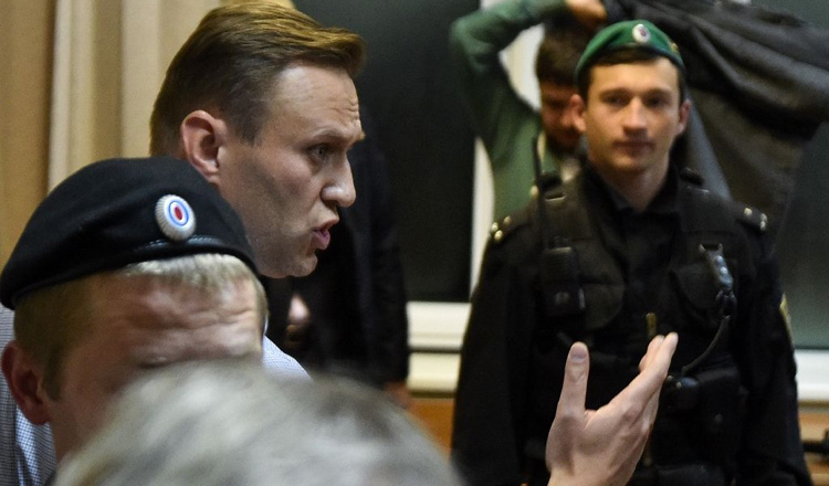 Russian opposition leader Alexei Navalny reacts during a hearing at Moscow's Simonovsky district court on October 2, 2017.