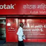 Kotak Mahindra Bank share price: A man walks past the Kotak Mahindra Bank branch in New Delhi, India.(