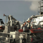 Emergency responders at the scene of the boat accident in the English Channel, with rescue operations underway.