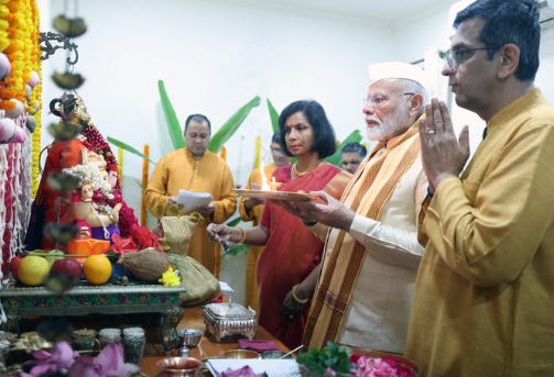 PM Modi offers prayers to Lord Ganesha at Chief Justice DY Chandrachud's residence, joining in Ganesh Chaturthi festivities with traditional rituals.